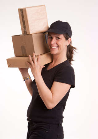 
Smiling woman with cap, holding a pile of packages
の写真素材
