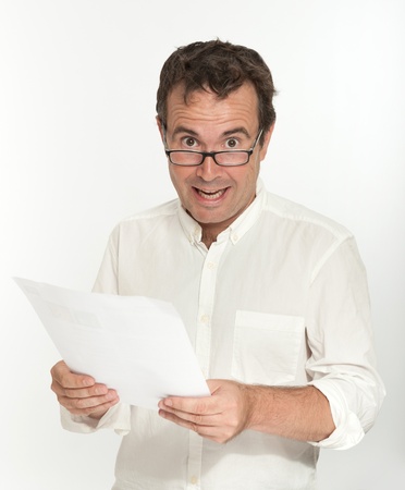 Man reading a document with a happy expressionの写真素材