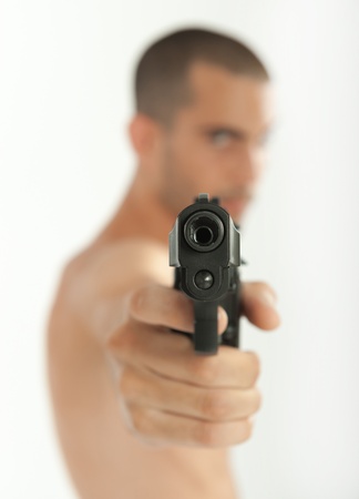 Man pointing his gun to the cameraの写真素材