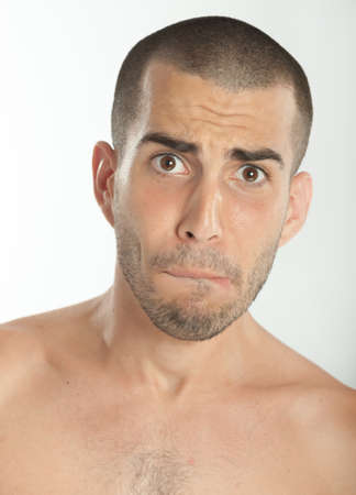 Young man with a scared expressionの写真素材
