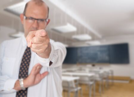 Scary teacher pointing a fingerの写真素材