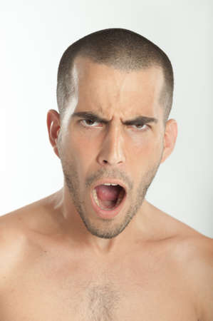 Portrait of a young man unhappily surprisedの写真素材