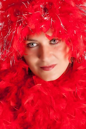 Woman in party gear with feather boaの写真素材