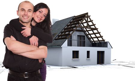 

Young loving couple with a housing project at the background
の写真素材