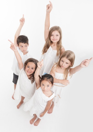 Group of children raising their handsの写真素材