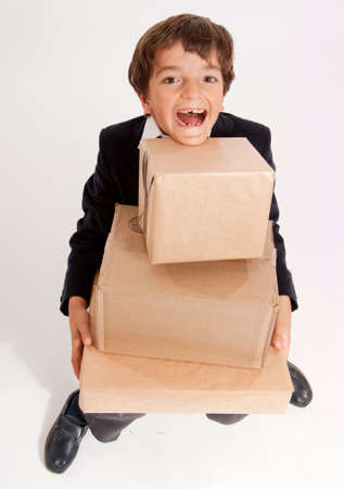 
Little schoolboy carrying big cardboard boxes
の写真素材