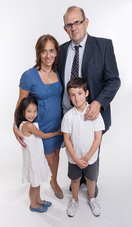 A family of four with a Caucasian boy and Chinese girlの写真素材