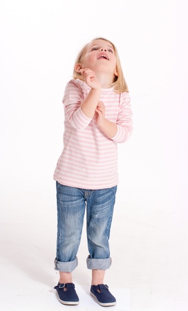 

Cute little blonde girl in jeans and a stripped t-shirt
の写真素材