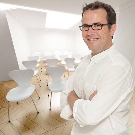Smiling confident man in a conference roomの写真素材