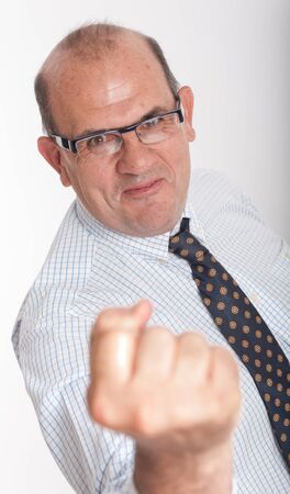 Man in business attire with clenched fistの写真素材