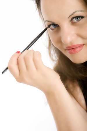 
Close-up shot on a green-eyed brunette applying eye-shadow
の写真素材