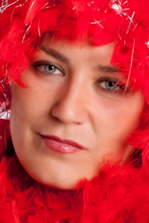 Woman in party gear with feather boaの写真素材