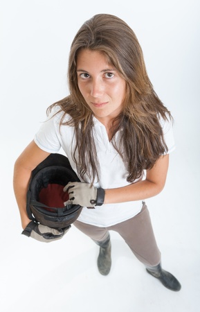 Young woman dressed in horse riding clothesの写真素材