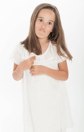 Funny little girl grimacingの写真素材