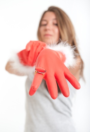 Young woman showing her glamorous protective glovesの写真素材