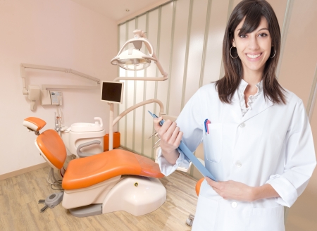 Smiling young woman in a dental clinicの写真素材