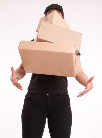 
Stressed woman in black trying to catch flying parcels
の写真素材