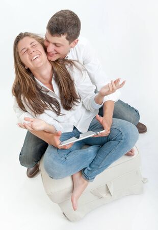 Young couple using a digital tabletの写真素材