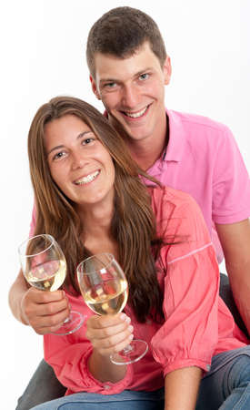 Young couple drinking white wineの写真素材