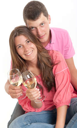 Young couple drinking white wineの写真素材