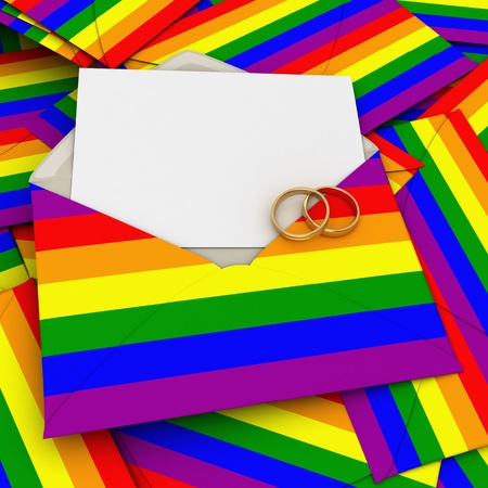 Envelope with the rainbow flag, a blank card and two wedding ringsの写真素材