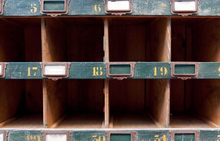 Old retro cubbyhole, with labels,  ideal for backgroundsの写真素材