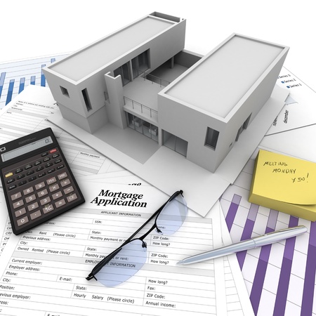 A building on top of a table with mortgage application form, calculator, blueprints, etc.. の写真素材