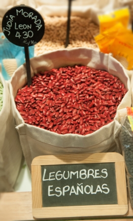 Sack with beans and a blackboard announcing Spanish legumesの写真素材