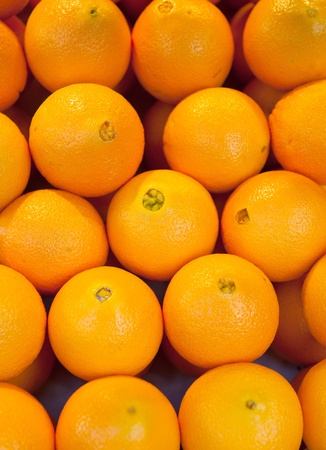 Oranges in a market stall, ideal for backgroundsの写真素材