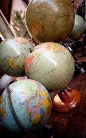 Collection of vintage world globes in an antiques shopの写真素材