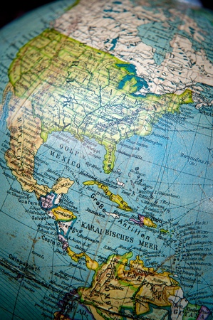 Close up shot on a vintage world globe focused on Central and North Americaの写真素材