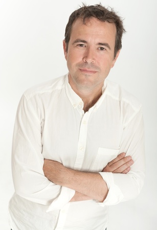 Portrait of a man on a white background with his arms crossedの写真素材