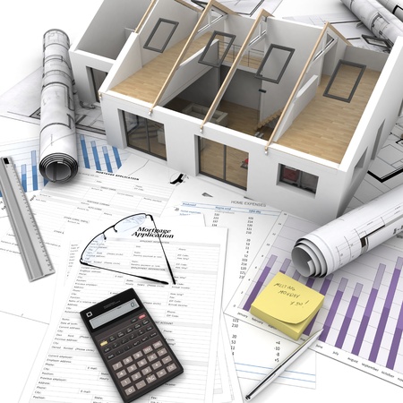 A house on top of a table with mortgage application form, calculator, blueprints, etc   の写真素材