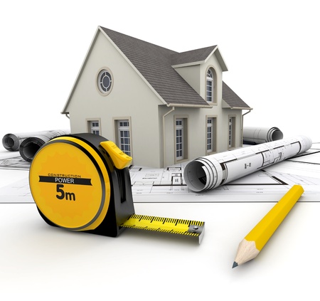 A House on top of blueprints, a pencil and a tape measureの写真素材