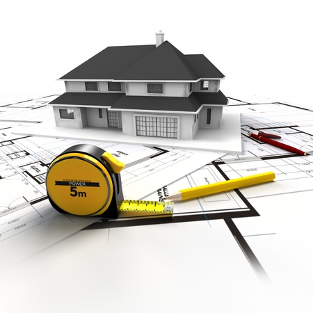 Aerial view of a house on top of blueprints and architect work toolsの写真素材