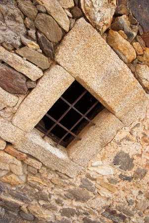 Iron barred stone window