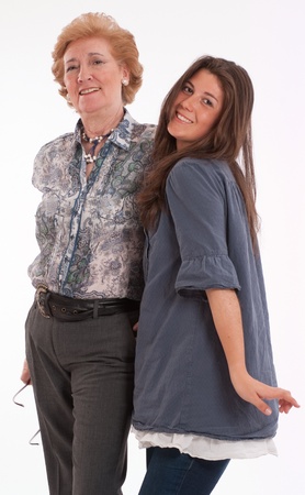 Female teenager posing with her grandmotherの写真素材