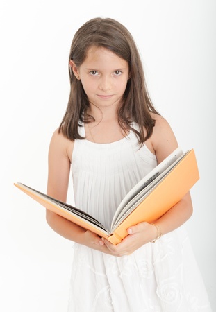 Young girl reading a bookの写真素材