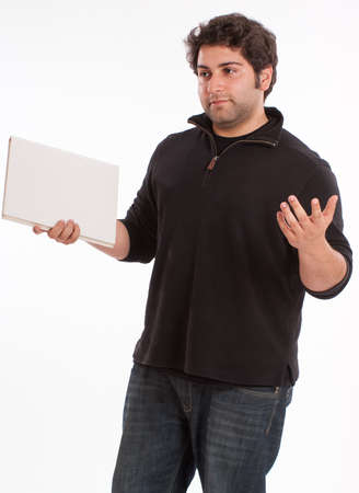 Casual young holding a bookの写真素材