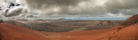 Volcanic landscape with the ocean in the background, panoramic viewの写真素材