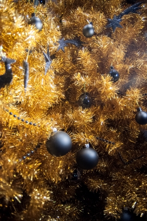golden Christmas tree with silver baublesの写真素材