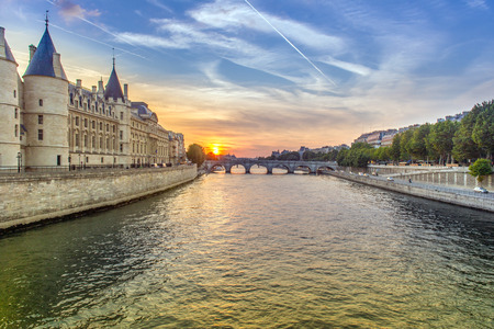 Beautiful landscape in Paris, with the sun setting over the river Seineの写真素材