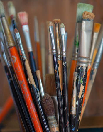 Paint brushes in a jar