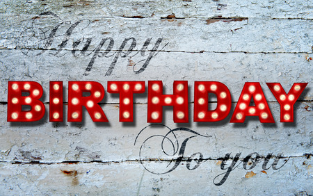 Shabby chic wooden background with glowing letters writing Happy Birthday to youの写真素材
