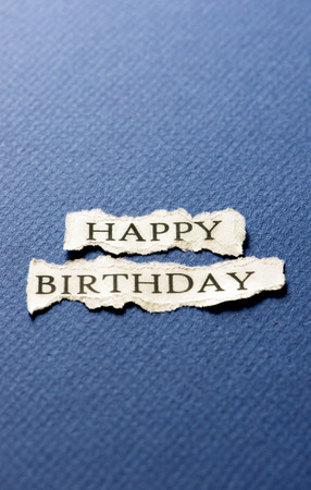 A scrap of paper with the words happy birthdayの写真素材