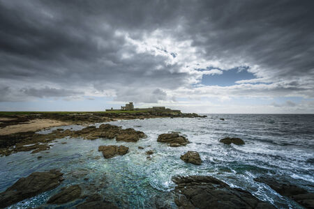 Rocky coast in Trevignon with fortressの写真素材