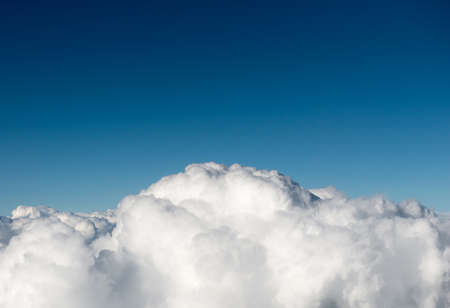 Fluffy cottonlike cloud taken from the skyの写真素材