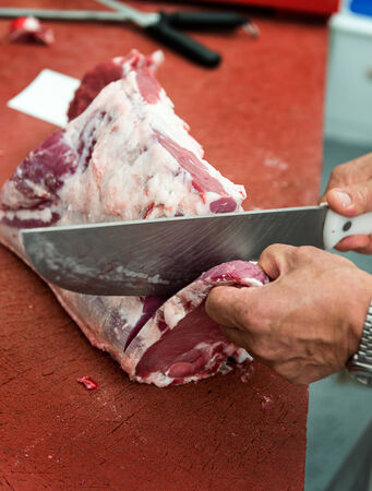 Butcher chopping rib steaksの写真素材