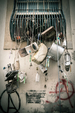 Old appliances hanging from a windowの写真素材