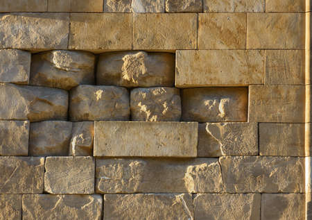 Old stone wall on an ancient  buildingの写真素材